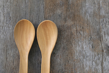 Wooden spoon on brown old wood table.