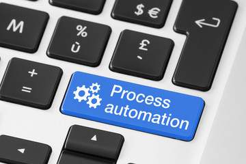 Process automation concept, close-up of button on computer keyboard