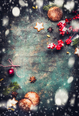 Fototapeta na wymiar Christmas background with fir branches, cookies , gingerbreads and snow, top view frame, vertical