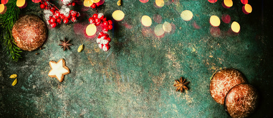Christmas banner with fir branches, cookies , gingerbreads and festive bokeh lighting, top view...