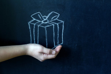 Present and child's hand abstract background concept