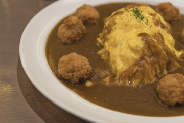 japanese curry fried chicken with omelette on top