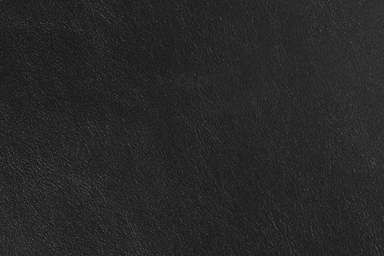 Black leather texture closeup detailed background.