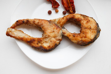 Fried  fish on a white background