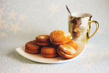 cookies on a white plate on a old book