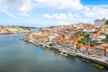 Obraz premium View of the historic city of Porto, Portugal with the Dom Luis bridge and blue sky / Ancient city Porto,metallic Dom Luis bridge.