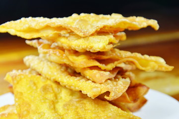 deep fried crispy dumpling strips on dish