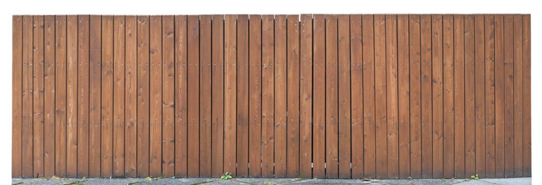 Solid wooden fence from brown vertical boards