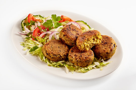 Oval plate of traditional falafel patties