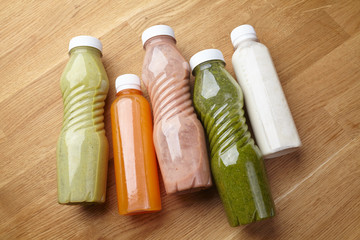 Fototapeta na wymiar bottles of juices and vegetable smoothies healthy food