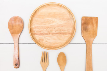 empty wooden dish, fork and spoon 