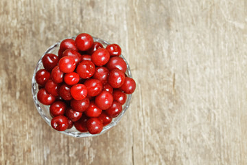 Cherry in a glass bowl above view
