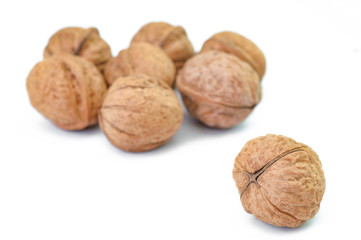 Bunch of ripe walnuts isolated on white background