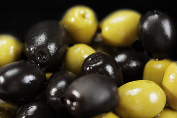 Black and green olives in a bulk