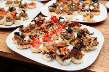 Bruschettas with meat and soft cheese
