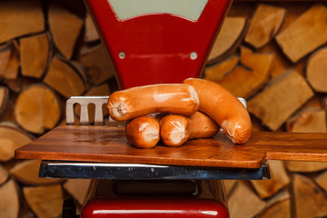 Sausage on red scales