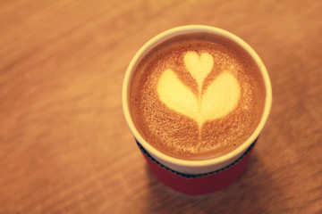 Latte in a takeaway cup