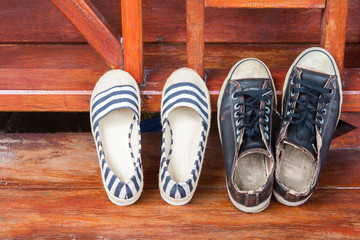 shoes man and woman on wood deck