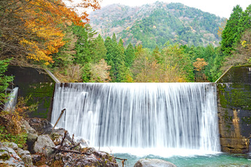 Waterfalls and colorful autumn leaves at Tsukechi valley