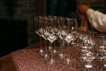 Empty wine glasses at a bar