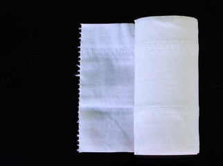 White Toilet Paper Tissue Rollon on Black  Background