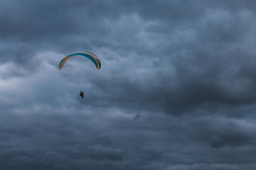 Paraglider in the dark sky