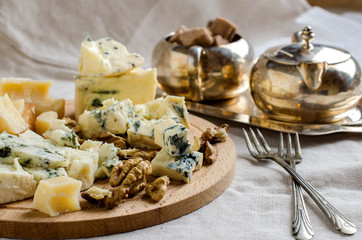 Parmesan and other cheeses on the table