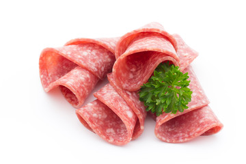 Salami sausage slices isolated on white background.