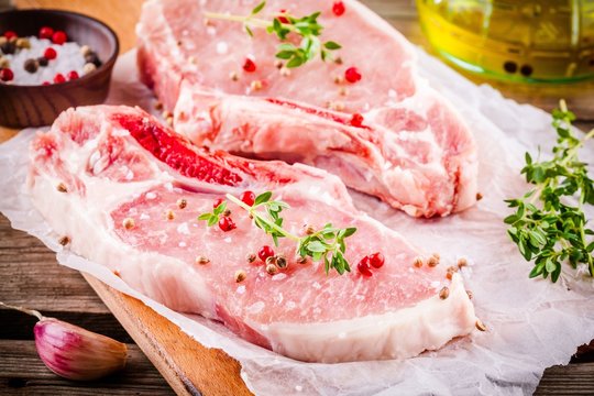 fresh raw meat of pork on a dark background