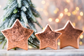Christmas bronze decoration. Holiday decorations bronze on bokeh