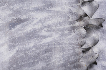 bakery background with cookie cutter and flour