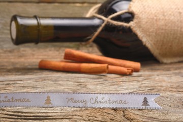 Bottle of red wine and christmas ornaments