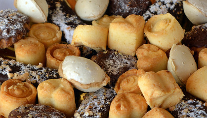 Christmas cookies with chocolate,nuts and coconut on a decorated table 