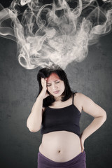 Pregnant mother feels headache with smoke