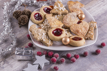 christmas cookies with stars and present on wooden background