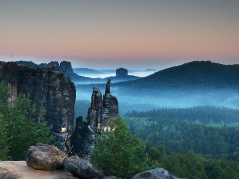 Autumn evening panorama view over sandstone rocks to fall valley of Saxony Switzerland.