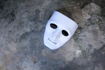 White mask on dark grunge texture