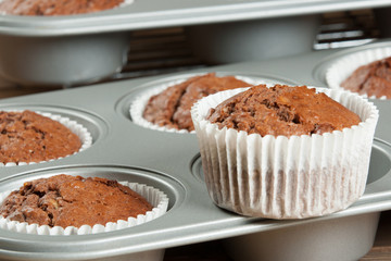 Homebaked Muffins With Chocolate, Banana, Coconut In Baking Tray
