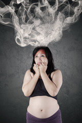 Woman worried something with smoke on head