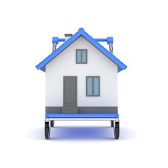 Model of house on wheeled platform on white background. Concept of property moving, delivering. 3D rendering.