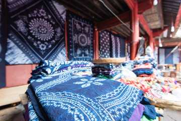 Blue cloth with ornaments on display in a Chinese market