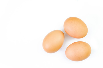 Three eggs are isolated on a white background