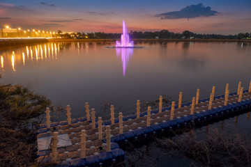 Fototapeta premium Beautiful fountain show with reflection on water