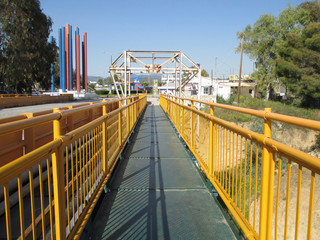 Yellow colored bridge over the Corinth Canal, Greece 