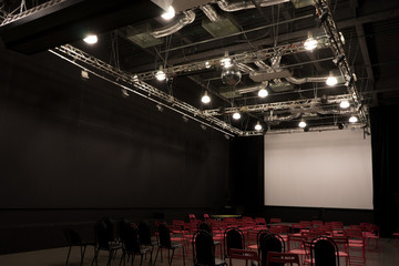 Conference hall with red chairs