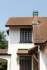 Front yard of old concrete house.