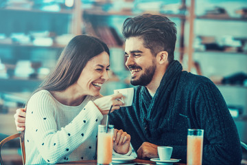 Beautiful couple having coffee on a date