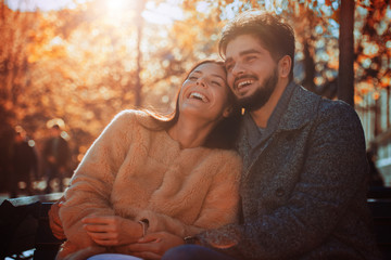Loving couple smiling and enjoying the autumn season