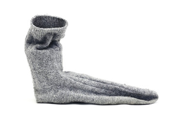 Dirty grey sock on a white background