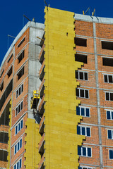 work on the external walls of glass wool insulation and plaster